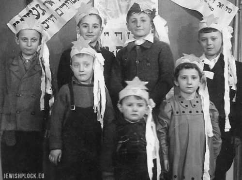 The children of the first survivors who came to Płock in 1945 celebrating Hanukkah